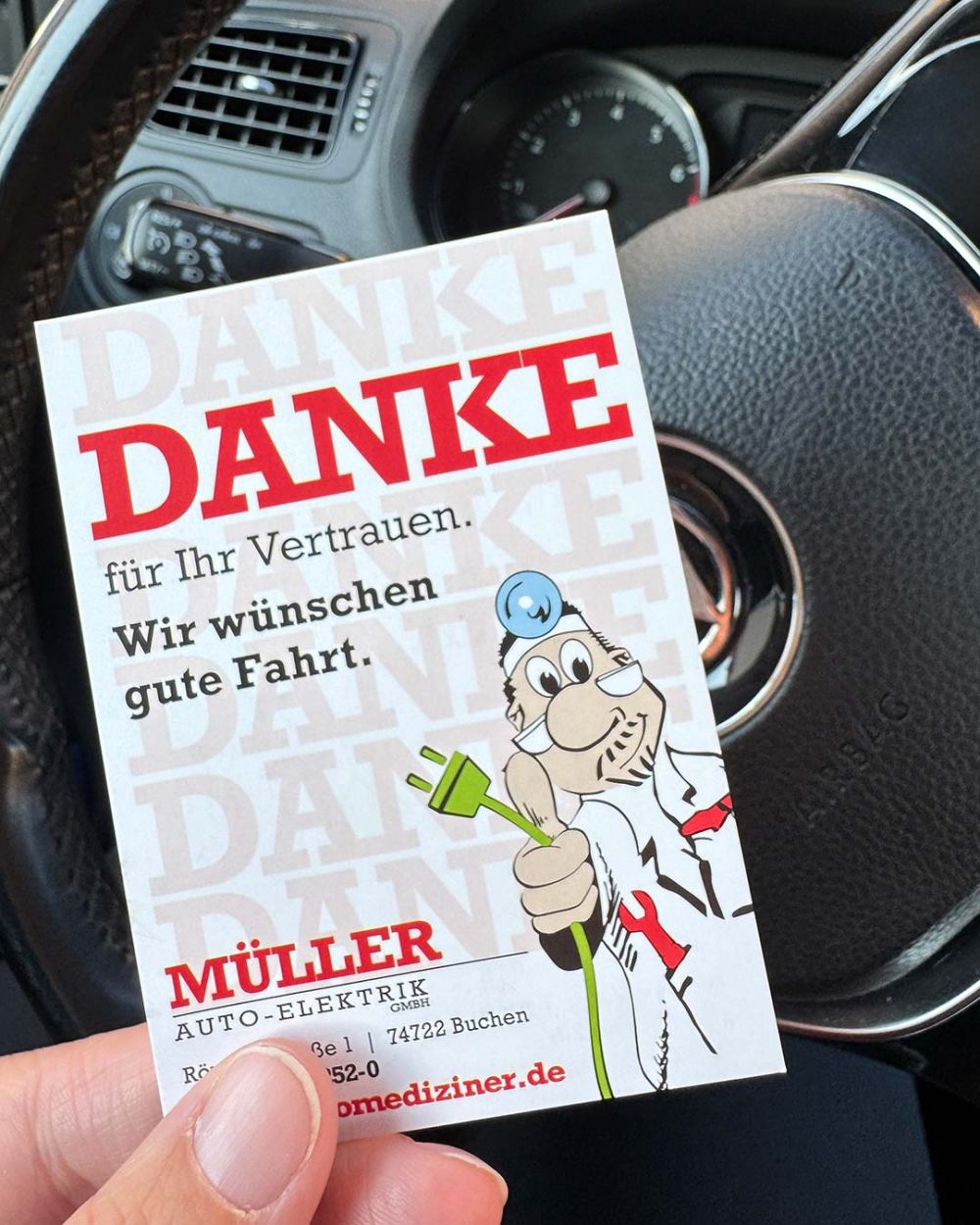 DANKE Karte im Auto  - Auto-Elektrik Müller